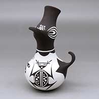 A polychrome crowned duck pot decorated with a dragonfly and geometric design
 by Anderson Jamie Peynetsa of Zuni