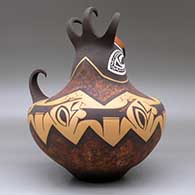 A crested parrot jar decorated with a deer with heart line and geometric design, click or tap to see a larger version