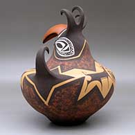 A crested parrot jar decorated with a deer with heart line and geometric design, click or tap to see a larger version