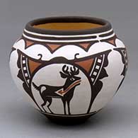 A small polychrome jar decorated with a three panel deer-in-his-house and geometric design
 by Carlos Laate of Zuni