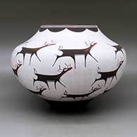 A polychrome jar decorated with a deer-with-heart-line and geometric design, click or tap to see a larger version
