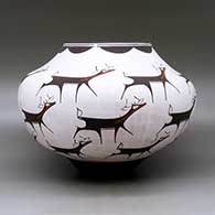A polychrome jar decorated with a deer-with-heart-line and geometric design, click or tap to see a larger version