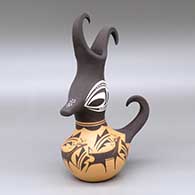 A duck pot with a feathered crown and deer-with-heart-line and geometric design
 by Anderson Peynetsa of Zuni