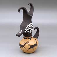 A polychrome duck pot decorated around the body with a deer with heart line and geometric design
 by Anderson Peynetsa of Zuni