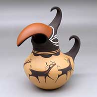 A polychrome parrot pot decorated around the body with a deer with heart line and geometric design
 by Anderson Peynetsa of Zuni