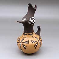 A small polychrome duck pot decorated with a dragonfly and geometric design
 by Anderson Jamie Peynetsa of Zuni