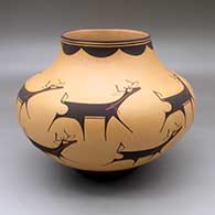 A polychrome jar decorated with a deer with heart line and geometric design
 by Anderson Peynetsa of Zuni