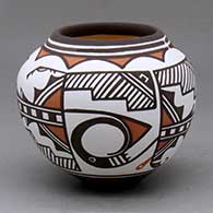 A small polychrome jar decorated with a two panel classic Zuni rainbird and geometric design
 by Carlos Laate of Zuni