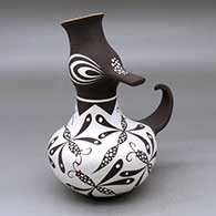 A polychrome duck effigy pot decorated with a dragonfly and geometric design
 by Anderson Jamie Peynetsa of Zuni