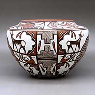 A high shouldered polychrome jar decorated with a two panel rosette, deer with heart line I n his house, rainbird, kiva step, fineline and geometric design. Best of Show and First Place ribbon  from San Diego Museum of Man. First Place ribbon from 2009 Zuni Festival of Arts and Culture, click or tap to see a larger version