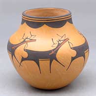 A polychrome jar decorated with a deer with heart line and geometric design
 by Anderson Peynetsa of Zuni