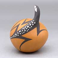 A polychrome seed pot decorated with a lizard head applique and lizard and geometric design, click or tap to see a larger version