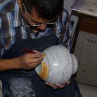 Painting orange paint with a yucca brush